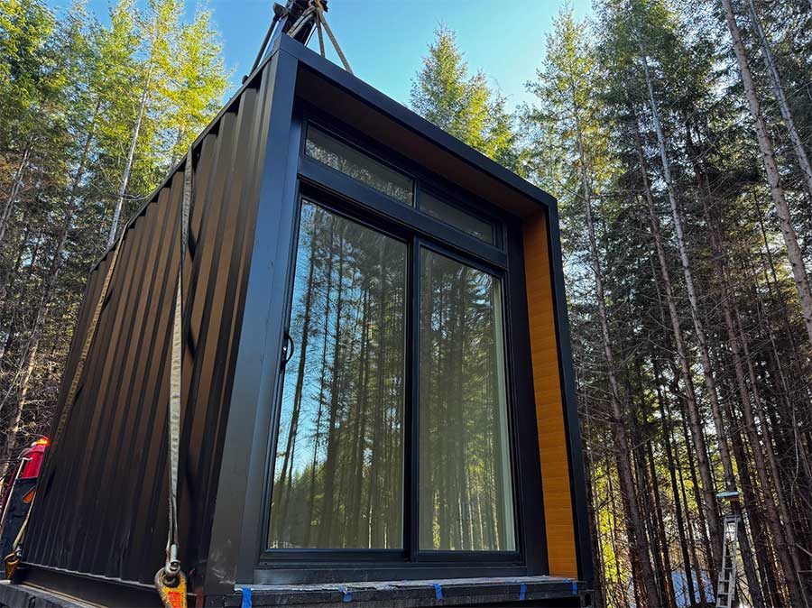 modular pod getting craned onto property